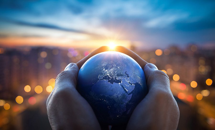 Hands holding a globe