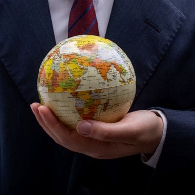 Hands holding a globe